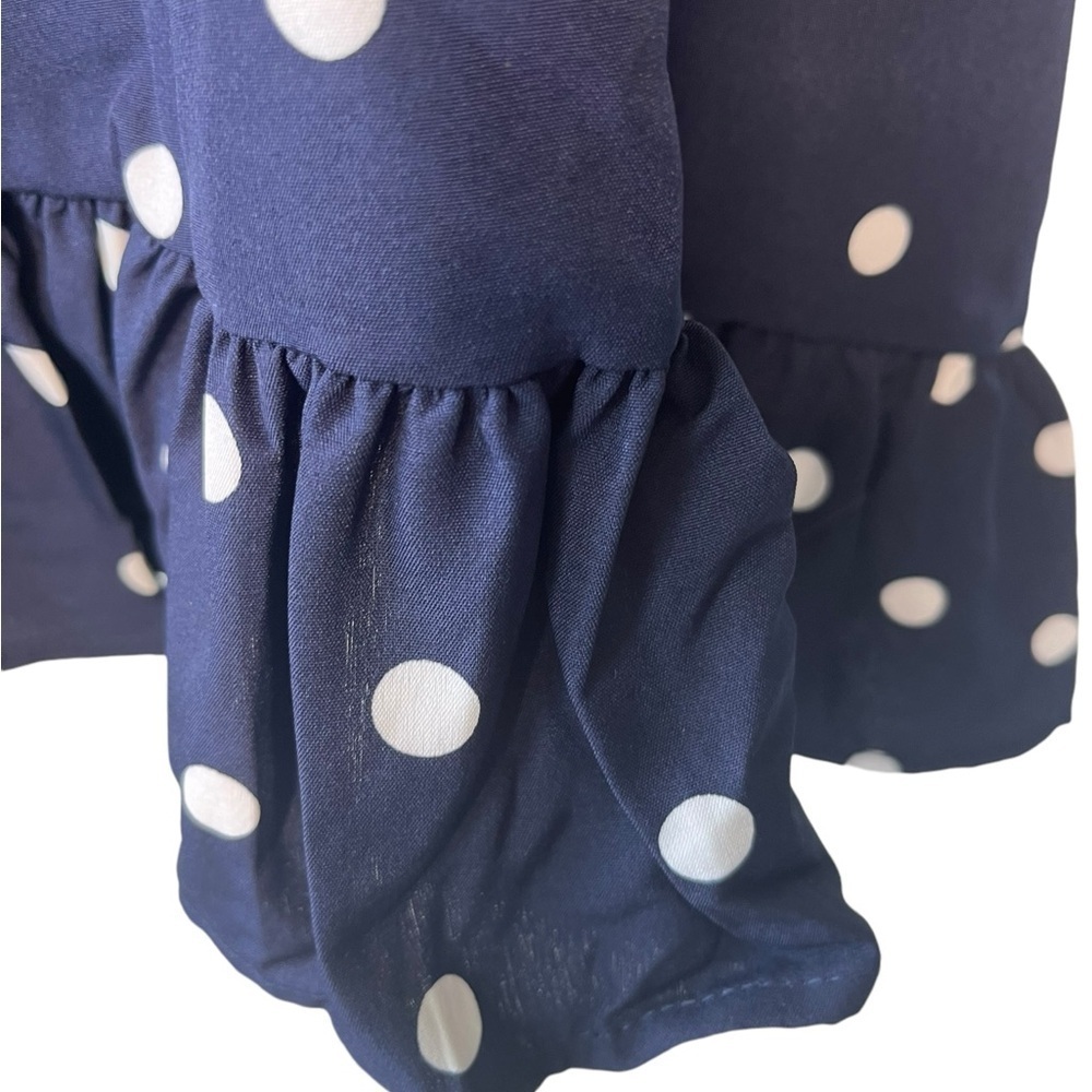 Navy and white sleeveless polkadot dress with ruffle bottom - Picture 5 of 7
